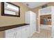 Bright hallway with cabinetry and countertop space that leads into the kitchen at 455 W Plumosa St, Bartow, FL 33830