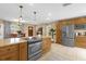 Well-equipped kitchen with granite countertops, stainless steel appliances, and an open flow to the dining area at 455 W Plumosa St, Bartow, FL 33830