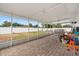 Spacious covered patio with brick flooring and a view of the backyard at 455 W Plumosa St, Bartow, FL 33830