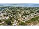 Expansive aerial view of a quiet residential neighborhood near a scenic lake under a clear blue sky at 4727 Wales St, Lake Wales, FL 33859