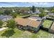 Aerial view of the property with a screened-in pool, lush greenery, and a well-maintained landscape at 4727 Wales St, Lake Wales, FL 33859