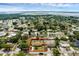 This aerial view showcases the property with a screened-in pool and its location in a serene lakeside neighborhood at 4727 Wales St, Lake Wales, FL 33859