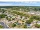 Aerial view showcases a backyard pool, convenient highway access, and nearby local commerce at 4727 Wales St, Lake Wales, FL 33859