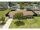 Aerial view of a charming single-story home with a fenced backyard and screened pool area at 4727 Wales St, Lake Wales, FL 33859