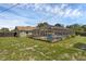 Backyard featuring a screened-in pool and a detached building offering privacy and ample space for outdoor activities at 4727 Wales St, Lake Wales, FL 33859