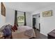 Comfortable bedroom with view to the yard, a large closet, and minimalist decor at 4727 Wales St, Lake Wales, FL 33859