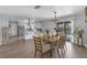 Bright dining area with a modern chandelier and sliding door leading to a pool at 4727 Wales St, Lake Wales, FL 33859
