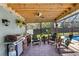 Screened patio featuring outdoor kitchen, seating and a view to the pool at 4727 Wales St, Lake Wales, FL 33859