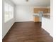 Open-concept dining area with hardwood floors, neutral walls, and a bright window at 6354 Sedgeford Dr, Lakeland, FL 33811