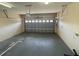 Well-lit garage with an automatic door, electrical outlets, and ample space for parking and storage at 6354 Sedgeford Dr, Lakeland, FL 33811