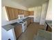 Spacious kitchen with tile floors, wooden cabinetry, and a full suite of appliances at 6354 Sedgeford Dr, Lakeland, FL 33811