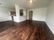 Spacious living room with hardwood floors and modern architecture, perfect for entertaining at 6354 Sedgeford Dr, Lakeland, FL 33811