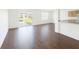 Bright living room with hardwood floors, neutral walls, and a sliding glass door at 6354 Sedgeford Dr, Lakeland, FL 33811