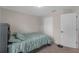 Inviting bedroom with neutral walls, carpet, a comfortable bed, and closet space at 6523 Evergreen Park Dr, Lakeland, FL 33813