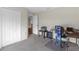 Bedroom featuring neutral walls, carpet flooring, a window with blinds, and a work desk at 6523 Evergreen Park Dr, Lakeland, FL 33813