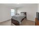 Cozy bedroom boasts soft carpet, natural light from the window, and a comfortable bed at 6523 Evergreen Park Dr, Lakeland, FL 33813