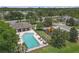 An aerial view of the community pool and playground in a tranquil setting with green space at 6523 Evergreen Park Dr, Lakeland, FL 33813