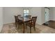 Cozy dining space featuring a wooden table set for six, with natural light at 6523 Evergreen Park Dr, Lakeland, FL 33813