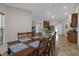 Dining area with a wood table, matching chairs, and natural light at 6523 Evergreen Park Dr, Lakeland, FL 33813