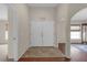 Bright entryway featuring double doors and tile flooring, leading to the main living area at 6523 Evergreen Park Dr, Lakeland, FL 33813