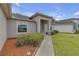 Beautifully landscaped front yard with a welcoming entrance and a well-maintained walkway at 6523 Evergreen Park Dr, Lakeland, FL 33813