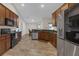 Spacious kitchen featuring granite countertops, stainless steel appliances, and ample cabinet space at 6523 Evergreen Park Dr, Lakeland, FL 33813