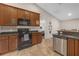 Kitchen equipped with granite countertops, stainless steel dishwasher, and built in microwave at 6523 Evergreen Park Dr, Lakeland, FL 33813