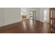Hardwood flooring in living area with access to the dining room, bathroom, and back porch at 6523 Evergreen Park Dr, Lakeland, FL 33813