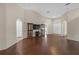 Open living room features beautiful hardwood floors and high ceilings for a spacious feel at 6523 Evergreen Park Dr, Lakeland, FL 33813