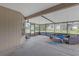 Screened patio featuring outdoor seating and views of the backyard and neighboring property at 6523 Evergreen Park Dr, Lakeland, FL 33813