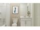 Cozy bathroom featuring a white vanity and toilet with a bathtub at 1181 Hour Glass Rd, Lakeland, FL 33801
