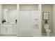 Neutral bathroom with white vanity, bathtub/shower combo and decorative accents at 1181 Hour Glass Rd, Lakeland, FL 33801