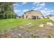 Large backyard includes a play area, shed, and ample green space, perfect for Gathering activities at 2721 Stonewood Dr, Lakeland, FL 33810