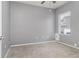 Bedroom featuring gray paint, a ceiling fan, carpeting, and a window at 2721 Stonewood Dr, Lakeland, FL 33810