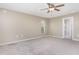 Spacious bedroom with plush carpeting and a window allowing natural light at 2721 Stonewood Dr, Lakeland, FL 33810