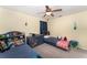 Cozy bedroom featuring twin beds, carpet, and a ceiling fan at 2721 Stonewood Dr, Lakeland, FL 33810