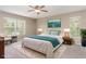Bedroom with plush carpet, ceiling fan and a large window at 2721 Stonewood Dr, Lakeland, FL 33810