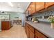 Open kitchen features wood cabinets and stainless steel appliances at 2721 Stonewood Dr, Lakeland, FL 33810