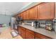 Well-lit kitchen featuring stainless steel appliances, tile backsplash, and ample countertop space at 2721 Stonewood Dr, Lakeland, FL 33810