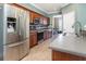 Kitchen showcases stainless steel appliances, tile backsplash, and wood cabinets at 2721 Stonewood Dr, Lakeland, FL 33810