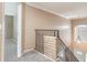Staircase with a black metal railing and landing with a safety gate at 2721 Stonewood Dr, Lakeland, FL 33810