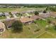 Aerial view of the home and the fully landscaped back yard and a golf course at 6442 Bendelow Dr, Lakeland, FL 33810