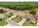 Aerial view of neighborhood with well-maintained lawns and mature trees at 6442 Bendelow Dr, Lakeland, FL 33810