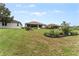 Manicured lawn and landscaping in the backyard at 6442 Bendelow Dr, Lakeland, FL 33810