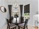 Cozy dining room featuring a round table, decorative lighting, and lots of natural light at 6442 Bendelow Dr, Lakeland, FL 33810