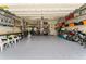 Spacious garage with ample storage shelves and a golf cart at 6442 Bendelow Dr, Lakeland, FL 33810