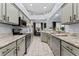 Modern kitchen with granite countertops, stainless steel appliances, and ample cabinet space at 6442 Bendelow Dr, Lakeland, FL 33810