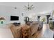 Relaxing living room featuring modern lighting, an entertainment center and comfortable seating at 6442 Bendelow Dr, Lakeland, FL 33810
