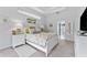 Serene bedroom featuring a tray ceiling, soft colors, and an ensuite bathroom at 6442 Bendelow Dr, Lakeland, FL 33810