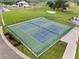 An aerial view of community tennis courts next to golf course, perfect for recreation and enjoying an active lifestyle at 6442 Bendelow Dr, Lakeland, FL 33810
